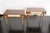 Pair of Mid-Century nightstands in rosewood with a parchment drawer. The thin tapered wooden legs feature a brass foot...