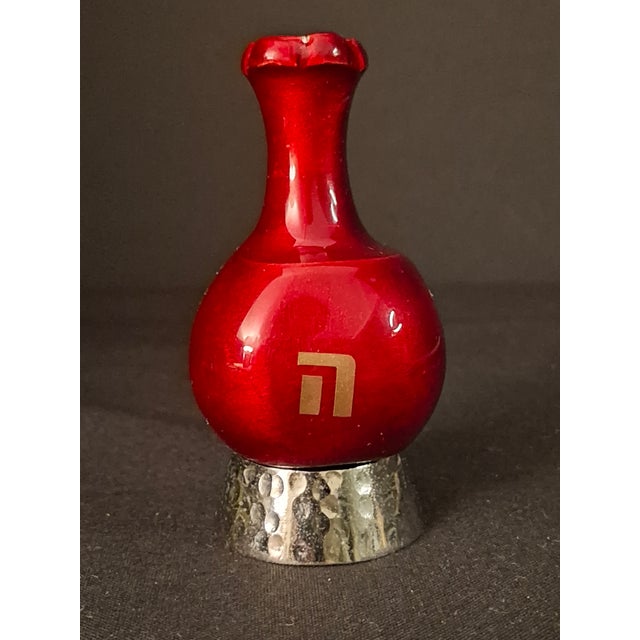 For sale is a solid cast metal dreidel (sevivon) designed in the botanical form of a rich crimson pomegranate, complete...