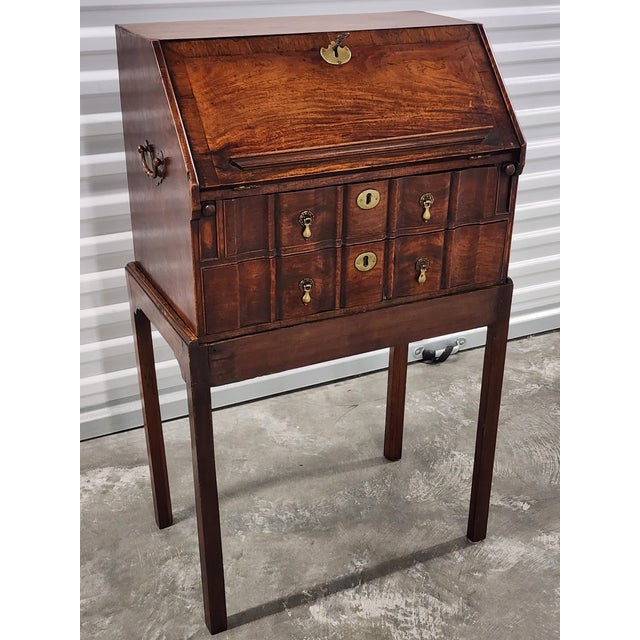 Fine and rare 18th century Chinese Export rosewood padouk bureau on stand. Block front design with a cross banded fall-...