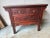 19th Century Chinese Carved Red Painted Consoler Table. This console table features 2 small drawers on the top. All...