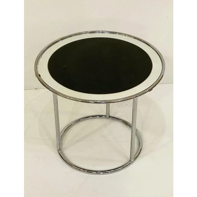 A fine English round or circular side table with a frame of chromed tubular steel from the Art Deco era, featuring a top...