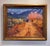 This oil painting captures a nostalgic scene of a dirt road winding through a vibrant autumn landscape, where warm hues of...
