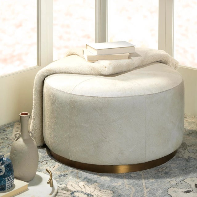 The Thackery collection of hair-on-hide poufs have the unique ability to add both glamour and comfort to any room of the...