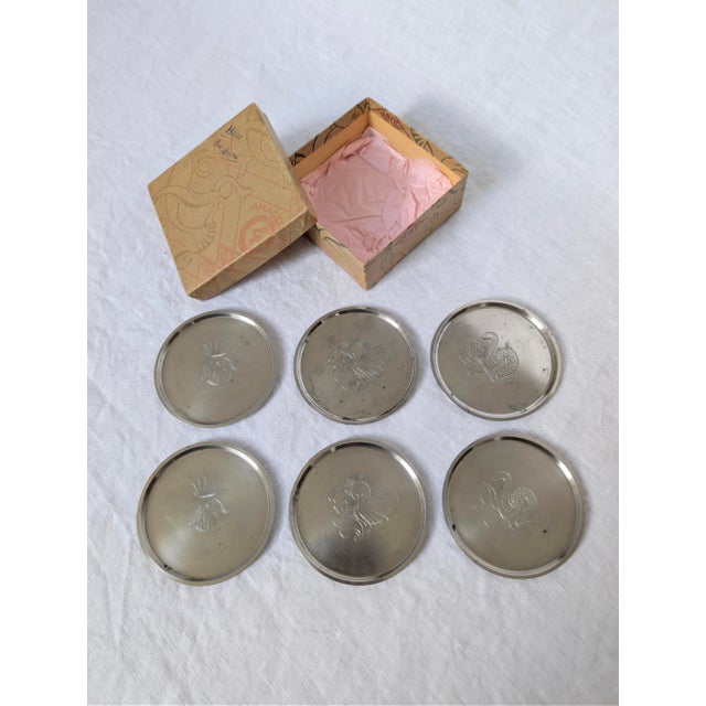 A complete set of 12 art deco pewter coasters by one of interior designs most sought after creators, Just Andersen. Hand...