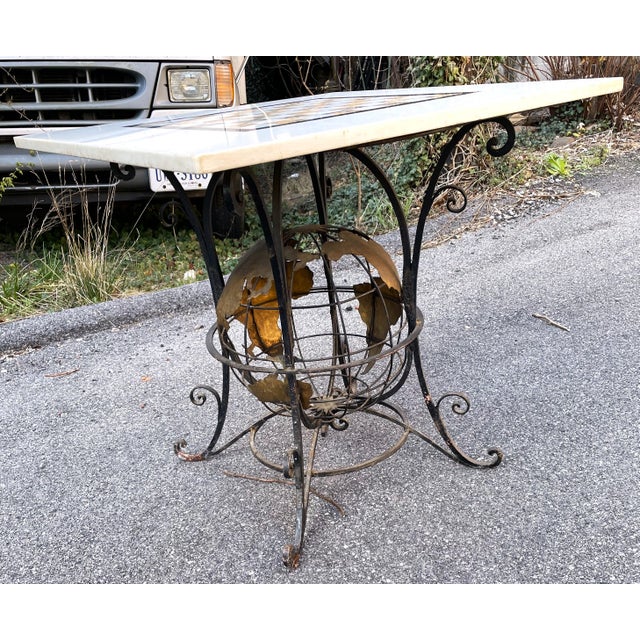 What a fabulous Iron based game table with a world globe in the center of the base. The metal work is fantastic with heavy...