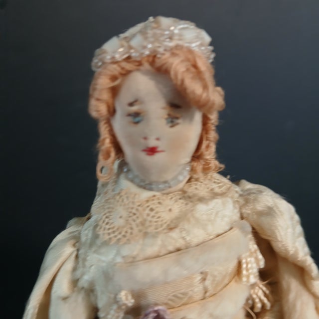 Handmade bridal doll ca. 19th c. in very good condition. Measures 9 1/2" H. about 5" wide all around. All fabric doll with...