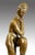 Sculpture in bronze, Girl with Leaning Leg. Bronze, the young girl rests one foot on a raised form, her chin leaning on...
