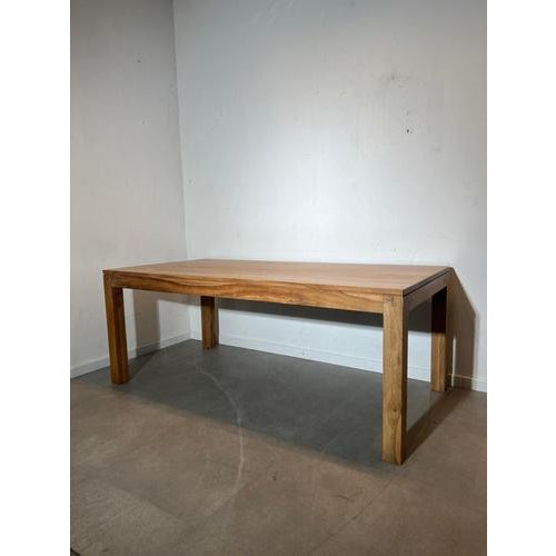 Beautiful solid wood dining table with a warm, natural grain and clean, minimalist lines. The thick top and sturdy square...