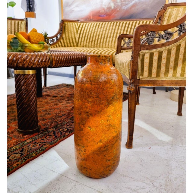 Brutalist style, clean design, bohemian, orange colored vintage floor vase from the 1970s. A cozy and unique home...