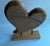 Vintage wood heart sculpture on a wood stand, held in place by two metal black rods. A beautiful, natural piece to add to...