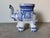 Charming vintage ceramic elephant garden stool, hand-crafted and hand-painted in a classic blue and white palette inspired...