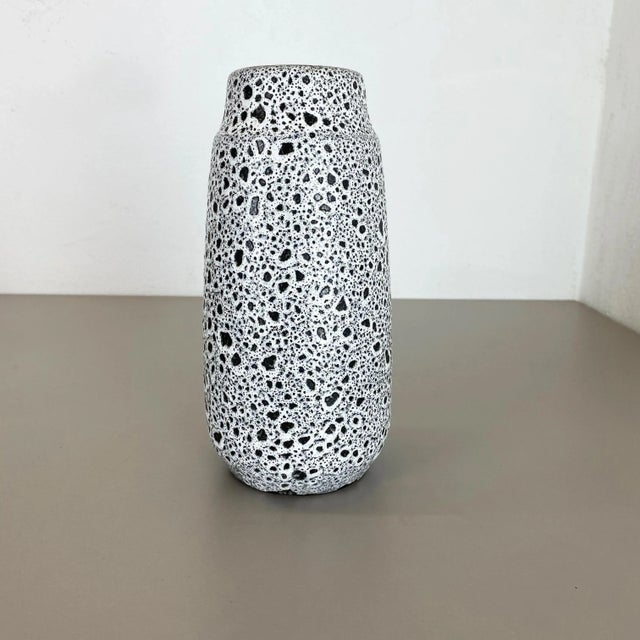 Fat lava art vase, heavy Brutalist glaze Producer: Scheurich, Germany Decade: 1970s This original vintage vase was...