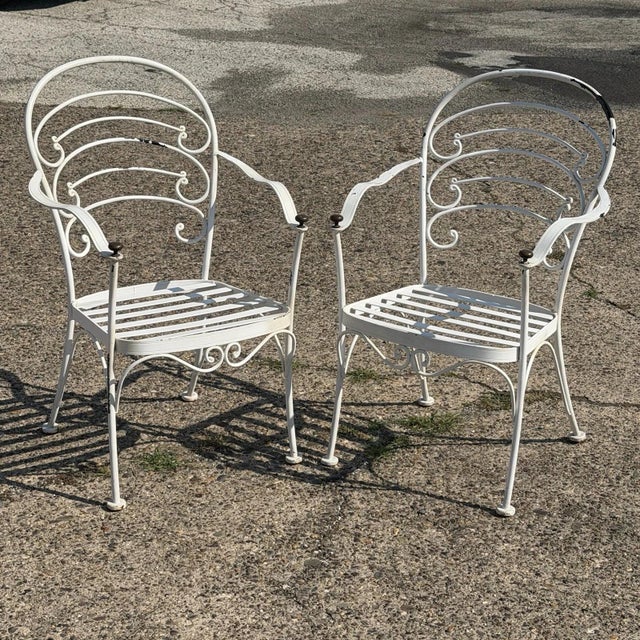 Modern Wrought Iron Scrolling Patio Dining Arm Chairs by Crown Leisure with Cushions - Set of 4. Circa Late 20th Century....