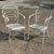 Modern Wrought Iron Scrolling Patio Dining Arm Chairs by Crown Leisure with Cushions - Set of 4. Circa Late 20th Century....