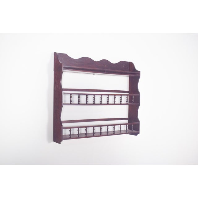 This elegant wooden plate rack is a fine example of traditional Portuguese kitchen furniture, designed to display plates...
