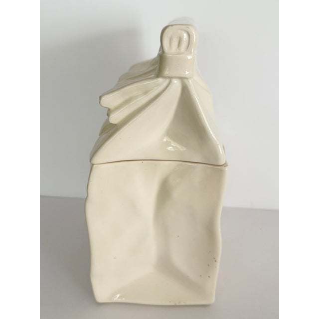 Adorable Vintage Ceramic Cookie Jar shaped like a folded paper bag. Creamy white glazed ceramic with a brown script...