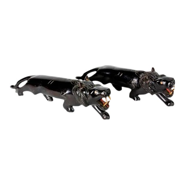 Pair of Carved Ebony Anglo Indian Lions For Sale