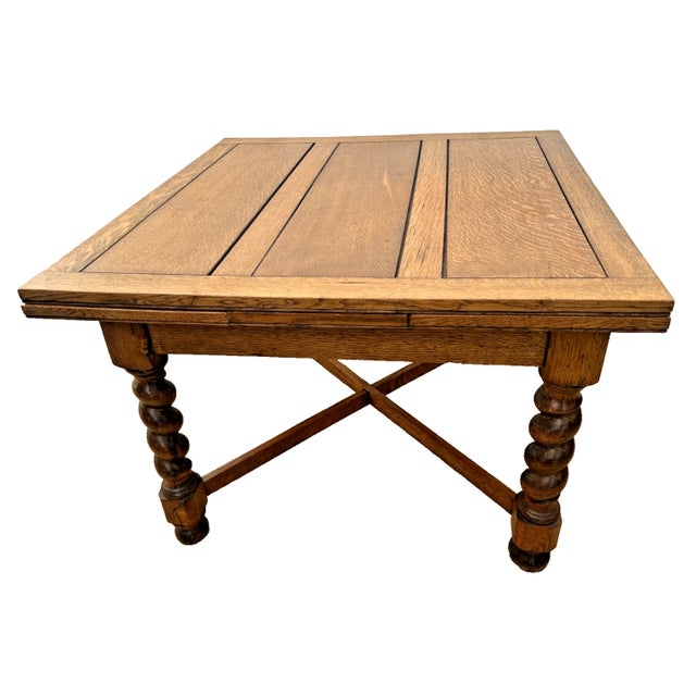 This is a remarkable antique American Victorian-era square extension dining table, circa 1890s, rendered in a beautiful...