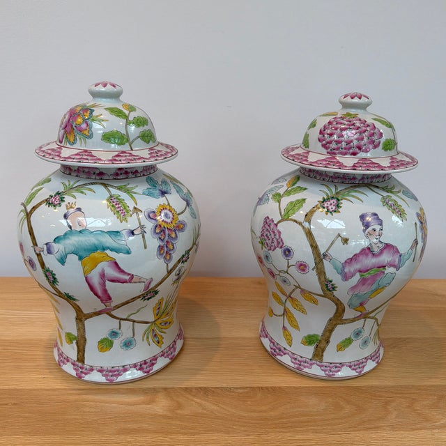 A striking pair of large decorative porcelain ginger jars by Altfield Hong Kong, featuring exuberant hand-painted...