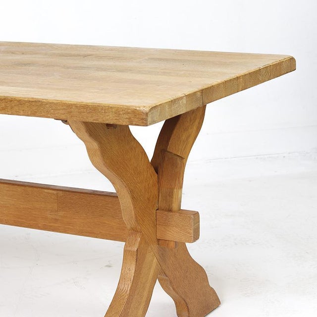Heavy-duty dining table made of solid oak in the Brutalist style, dating from the 1960s. Crafted from thick oak with...