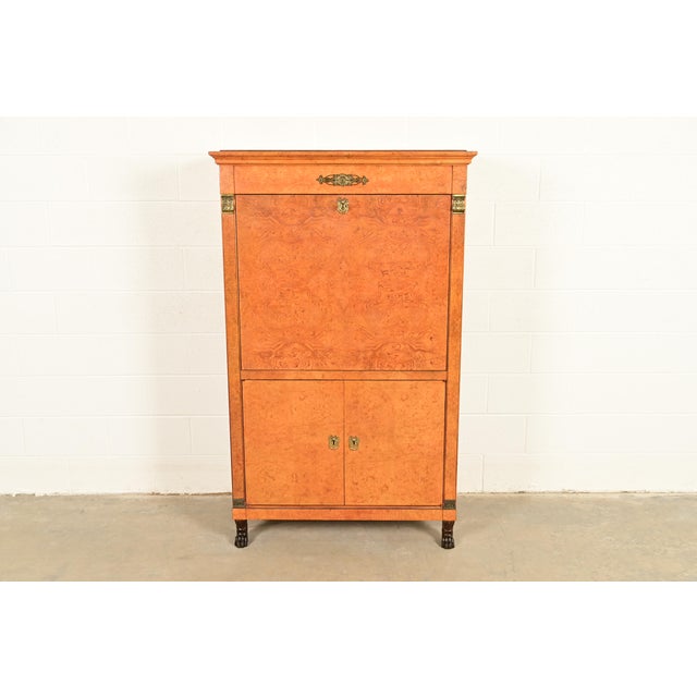 A stunning French Empire, Neoclassical, or Biedermeier style abattant bar cabinet or liquor cabinet By Baker Furniture...