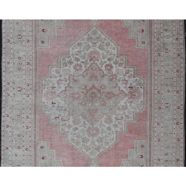 Measures: 7'8 x 13'5 Turkish Vintage Oushak Rug with Geometric Design With A Soft Coral Color. Country of Origin: Turkey;...