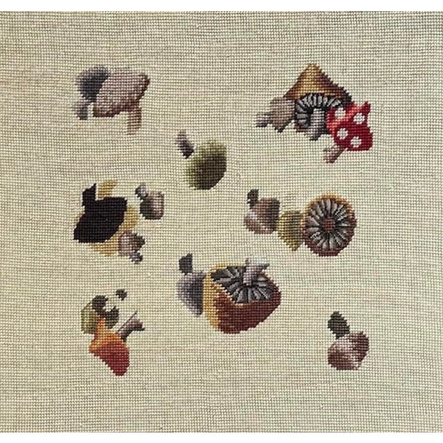 A charming, vintage, handmade needlepoint. Features a collection of varied mushrooms on a light toned ground. Housed in a...