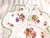 This is a white unmarked three section serving tray with handle. It has a multicolor floral design in each section and a...