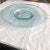 Round glass sky blue platter with stand. Circa 1990s.