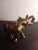 This is a Gold Tone Pot Metal 6" Trunk Up Lucky Elephant Figurine. Procured at auction BOX 21