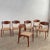 Stunning set of six Scandinavian modern, dining side chairs feature elegantly sculpted teak frames with contoured backs...