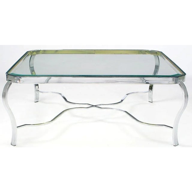 Quite possibly Milo Baughman, this coffee table has a neoclassic design combined with the metals of choice for the 70s....