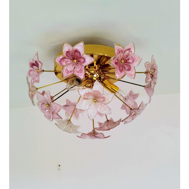Add an elegant and romantic touch to your space with this pink Murano style flower flush mount ceiling light. The glass...