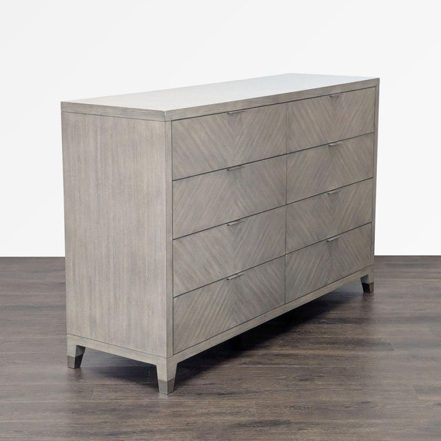 This Williams Sonoma Home dresser features a sleek gray wood finish and a modern, clean-lined design. With eight spacious...