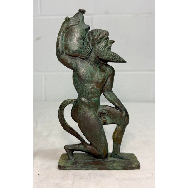 Up for sale is an exquisite antique bronze statue of a Satyr, a mythical creature from Greek mythology. This sculpture...
