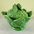 From Portugal, a hand potted majolica glazed cabbage leaf lidded oval shaped tureen, circa 1930s. Rustic, and showing the...