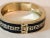 This Vintage Black Enamel Gold Greek Key Hinged Bangle is a tried and true classic! Perfect for the office, church or e...