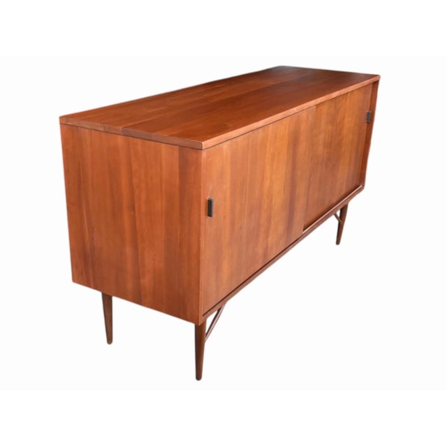 Beautifully restored 1960s Mid-Century Modern walnut credenza, expertly handcrafted from solid walnut wood in the timeless...