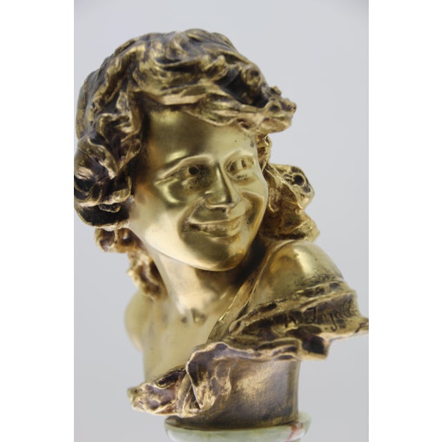 Art nouveau bronze "l'enfant rieur" (the laughing child) on an onyx base, signature a. Injalbert on the dress, foundry...