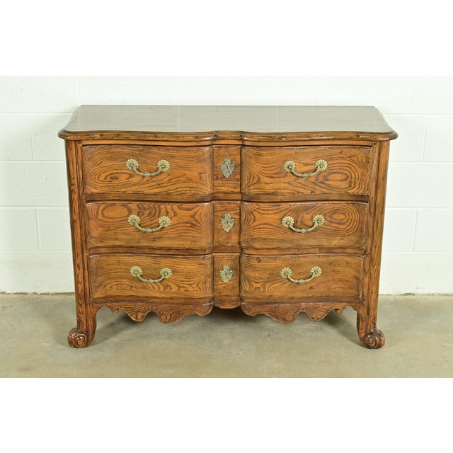 An exceptional French Provincial Louis XV style dresser, commode, or chest of drawers By Baker Furniture USA, Circa 1980s...
