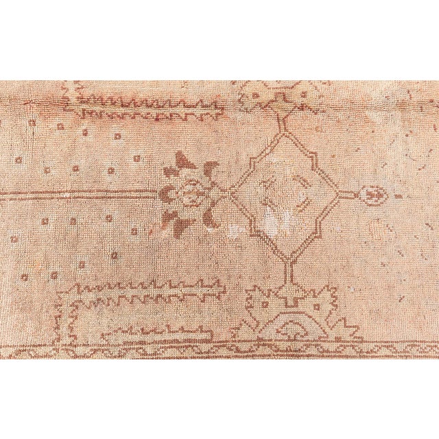 This exquisite antique Turkish Oushak rug exemplifies the refined artistry and subtle beauty characteristic of Oushak...