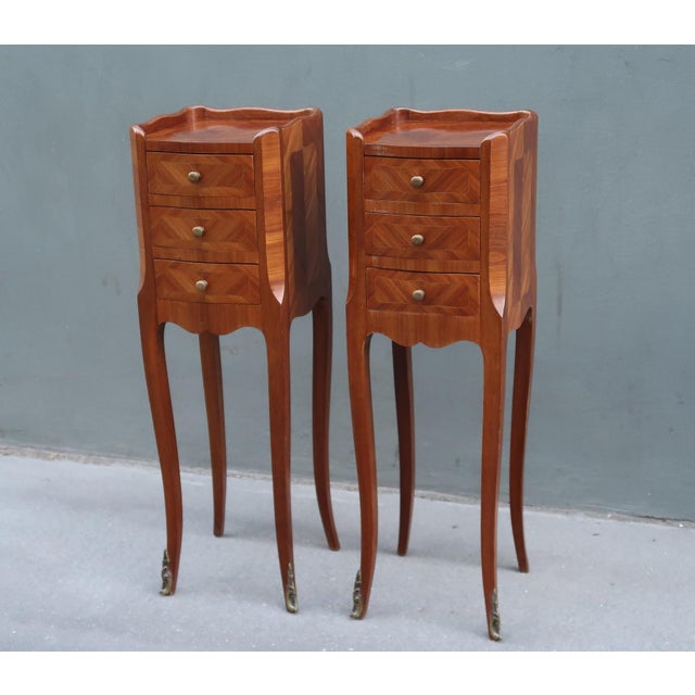 Very elegant set of two narrow rosewood french Louis XV style side tables nightstands. Parisian work from the middle of...