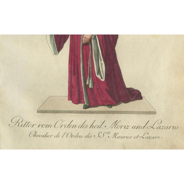Knight of the Holy Saints Maurice and Lazarus - Historic 18th-Century Hand-Colored Engraving This exquisite hand-colored...