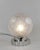 SABINO A gorgeous French 1925-1930 art deco table lamp in nickel plated solid brass or bronze holding a small sphere in...
