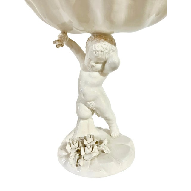 Vintage ceramic shell with putti and floral base. Marked Made in Italy in the Capodimonte style.