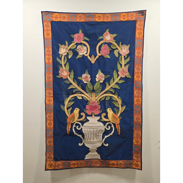 Beautiful early 20th-century tapestry depicting a richly detailed composition centered around a large ornamental urn...