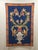 Beautiful early 20th-century tapestry depicting a richly detailed composition centered around a large ornamental urn...