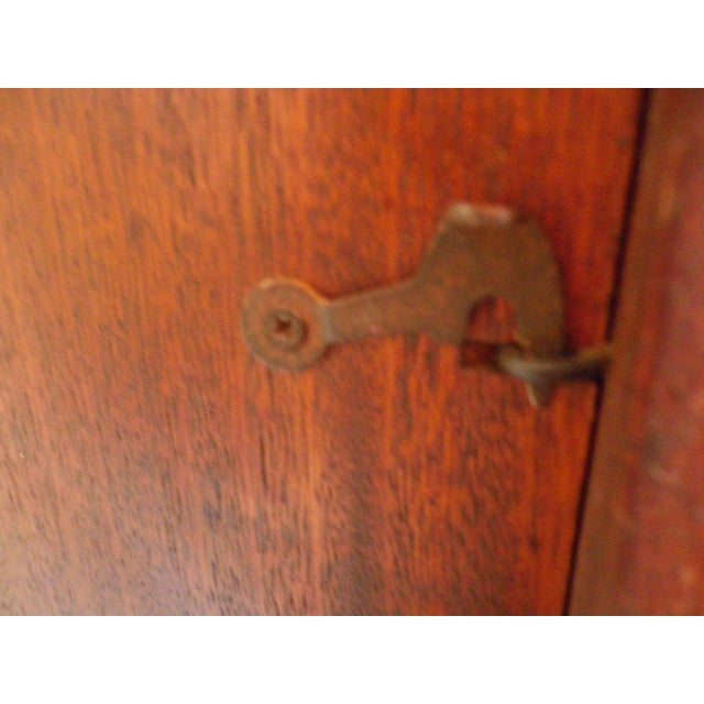 Morbier France faux chime wall clock. 1970s. Entirely original, with a wooden frame, intricately carved on both sides of...