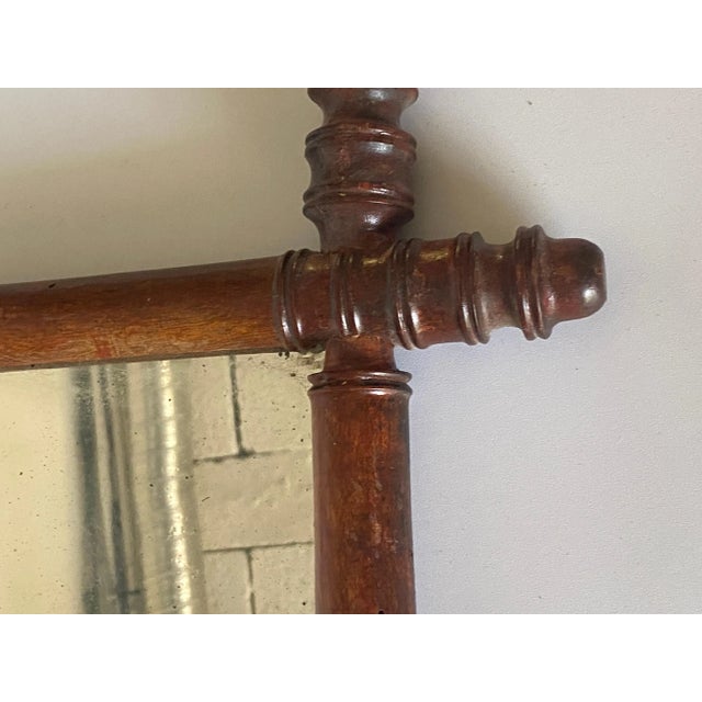 This is a faux Bamboo, mirror, in a small size. Brown Color. It has been made in France Circa 1940.