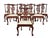 Set of eight George III style mahogany dining chairs. Set includes two armchairs and six side chairs. Chairs feature rich,...